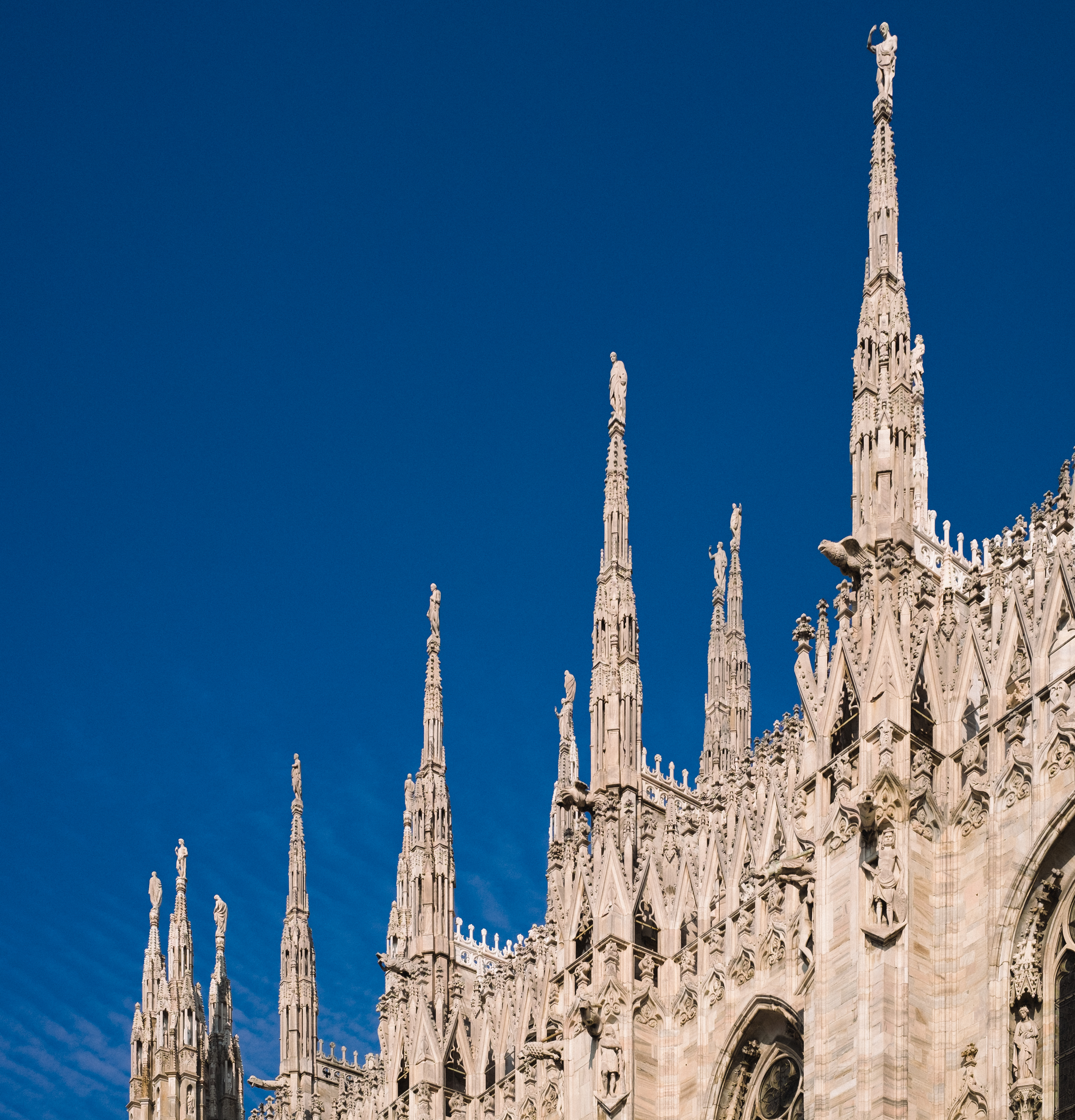 Detail of medieval cathedral against blue sky